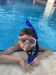 Max with goggles and snorkel at the outdoor swimming pool of the Grand Hotel Park