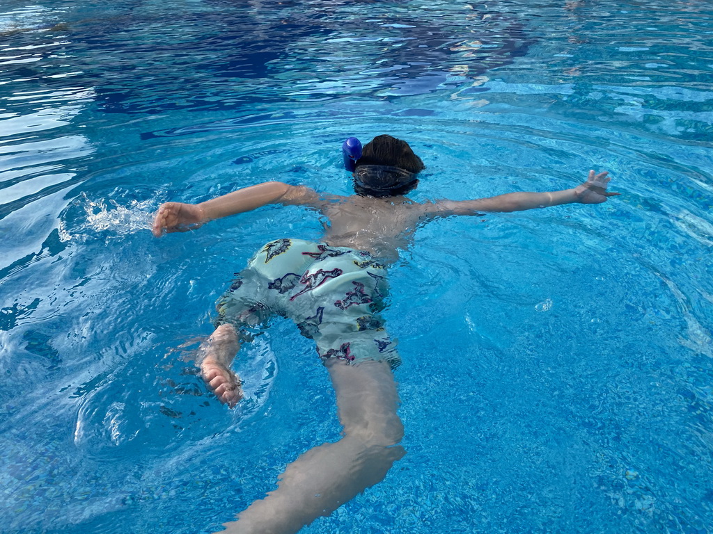 Max with goggles and snorkel at the outdoor swimming pool of the Grand Hotel Park