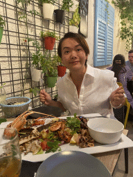 Miaomiao with a sea food platter at the Fish Bar El Pulpo