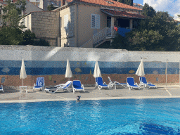 Max with goggles and snorkel at the outdoor swimming pool of the Grand Hotel Park