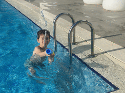 Max with a water gun at the outdoor swimming pool of the Grand Hotel Park