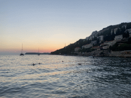 The Adriatic Sea, the Kolocep island and the Promenada Lapad path, viewed from the Uvala Lapad Beach, at sunset