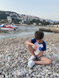 Max eating churros at the Vis Beach, at sunset