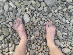 Tim`s feet in the water at the Vis Beach, at sunset