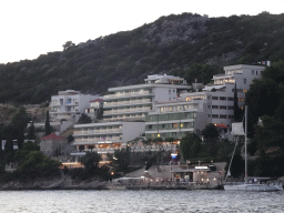 Buildings along the Promenada Lapad path, viewed from the Vis Beach, at sunset