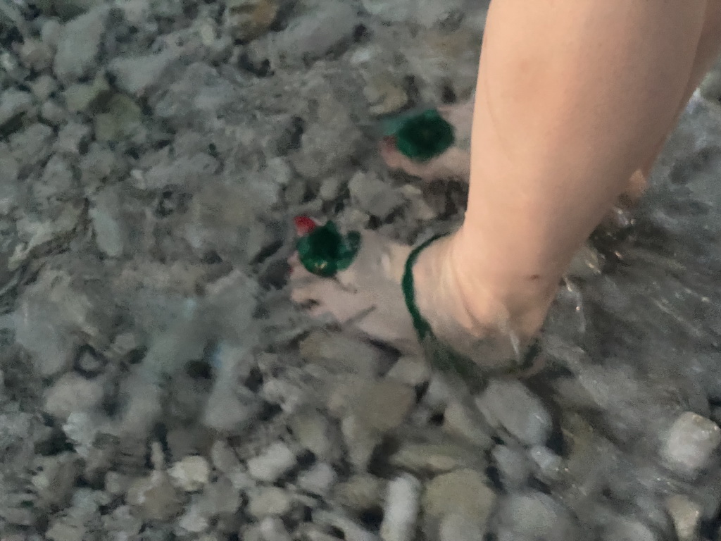 Miaomiao with an Octopus on her foot at the Vis Beach, at sunset