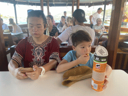 Miaomiao and Max eating chips at the Elaphiti Islands tour boat