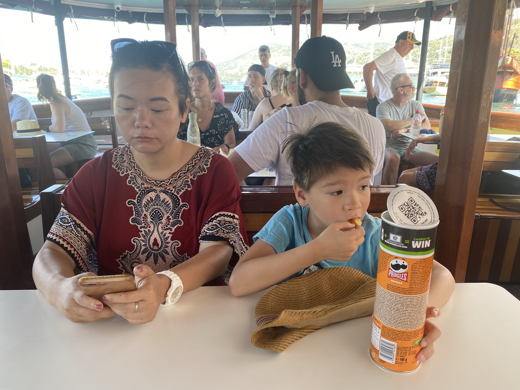 Miaomiao and Max eating chips at the Elaphiti Islands tour boat