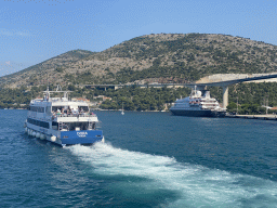 Tour boat and the cruise ship `SeaDream Yacht Club` at the Gru Port, viewed from the Elaphiti Islands tour boat