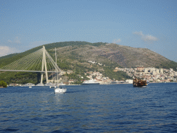 Boats and old ship leaving the Gru Port and the Franjo Tudman Bridge over the Rijeka Dubrovacka inlet, viewed from the Elaphiti Islands tour boat