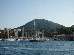 Boats at the Gru Port and the Velika Petka Hill, viewed from the Elaphiti Islands tour boat