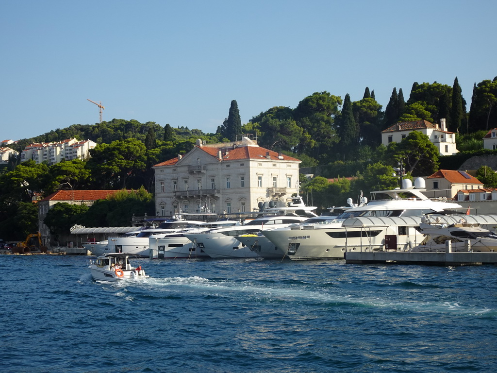 Boats in front of the Department of Economics and Business Economics building of the University of Dubrovnik at the Lapadska Obala street, viewed from the Elaphiti Islands tour boat