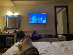 Tim playing `Pokémon Shield` on the Nintendo Switch in our room at the Grand Hotel Park