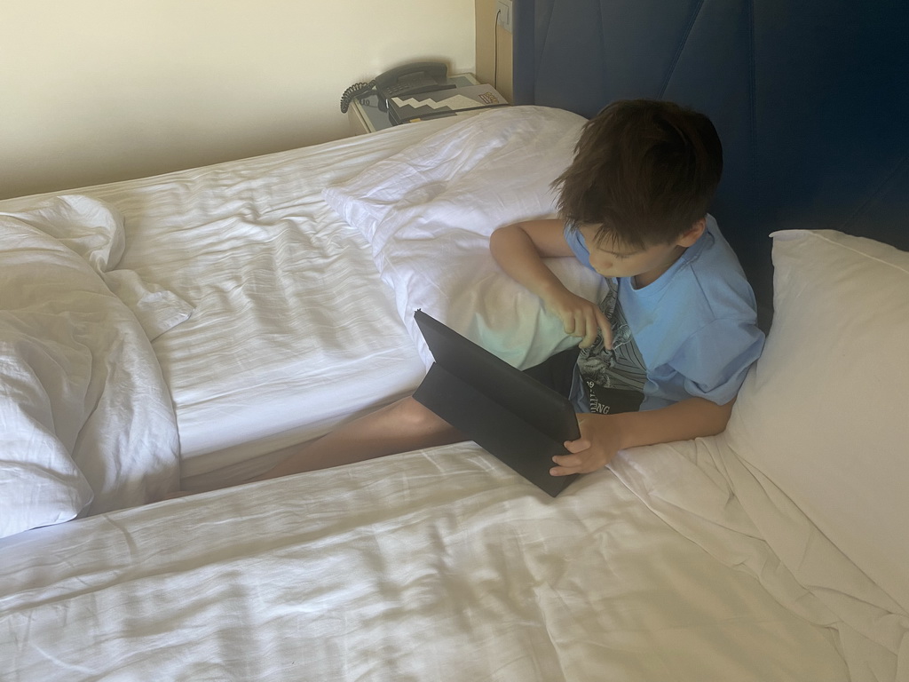 Max playing on his iPad in our room at the Grand Hotel Park
