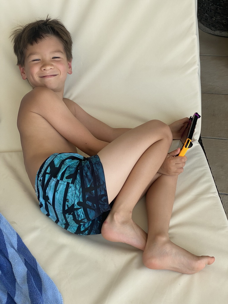 Max playing on his Nintendo Switch at the indoor swimming pool of the Grand Hotel Park