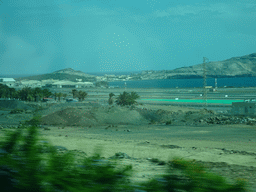 The Gran Canaria Airport, the Bahía de Gando bay and the Punta de Gando hill, viewed from the tour bus on the GC-3 road