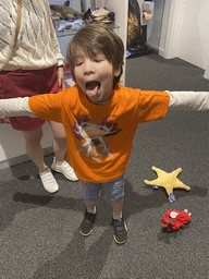 Max with an Axolotl shirt at the Souvenir Shop at the Poema del Mar Aquarium