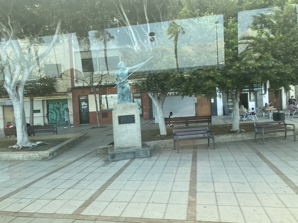 Statue at the Plaza de Santa Isabel square, viewed from the bus to Maspalomas on the GC-1 road