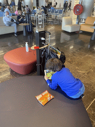 Max with playing iPad at the gate at the Gran Canaria Airport