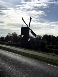 The Ter Leede windmill, viewed from the car on the Zuid Hollandweg road