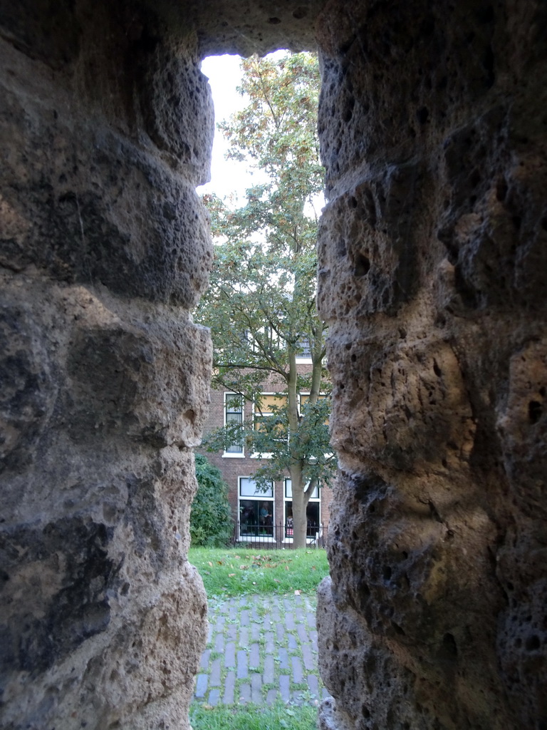 Houses at the Oude Rijn street, viewed through a window at the north side of the Burcht van Leiden castle