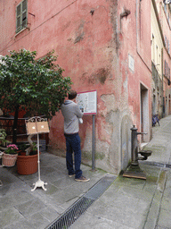 Tim looking at a map at the Via Guani street