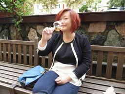 Miaomiao with wine at the Bar Cafe Cristal at the Piazza del Popolo square