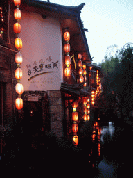 Houses and canal in the Old City of Lijiang, at sunset
