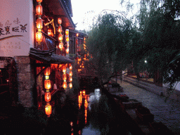 Houses and canal in the Old City of Lijiang, at sunset