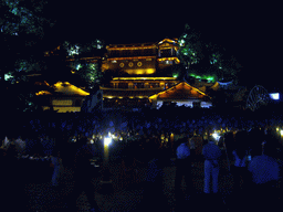 Water wheel and Qian Xue Lou Hotel at Yuhe Square in the Old City of Lijiang, by night