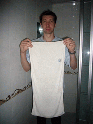 Tim with a towel in our bathroom in the Sunny 100 Business Hotel