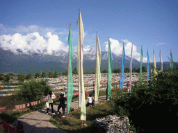 Prayer flags in a Minority Village near Lijiang, with view on Jade Dragon Snow Mountain