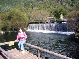 Miaomiao`s mother at the Three-Tier Waterfall and Divine Spring at Jade Water Village