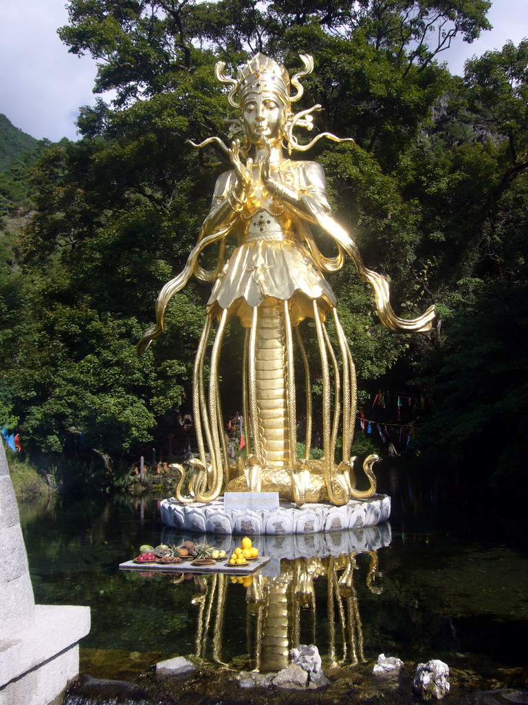 Statue of Dongba human god at Jade Water Village