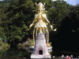 Statue of Dongba human god at Jade Water Village