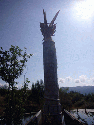 Statue of Dongba nature god at Jade Water Village