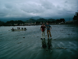 Tim with his friend and boats at Limbe Beach