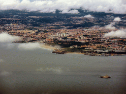 The Farol do Bugio tower in the Rio Tejo river and the town of Carcavelos, viewed from the airplane from Amsterdam