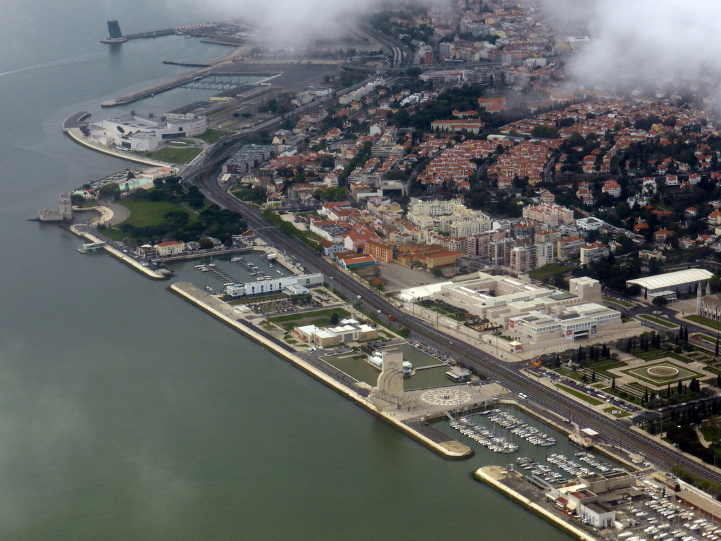 The Belém district of Lisbon, with the Torre de Belém tower, the Museu do Combatente museum, the fishing dock, the Belém Cultural Center and the Monument to the Discoveries, the Jerónimos Monastery and the Parque da Praça do Império park, viewed from the airplane from Amsterdam