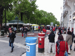 Fans of the S.L. Benfica soccer team watching the championship game on a screen at the Avenida da Liberdade avenue