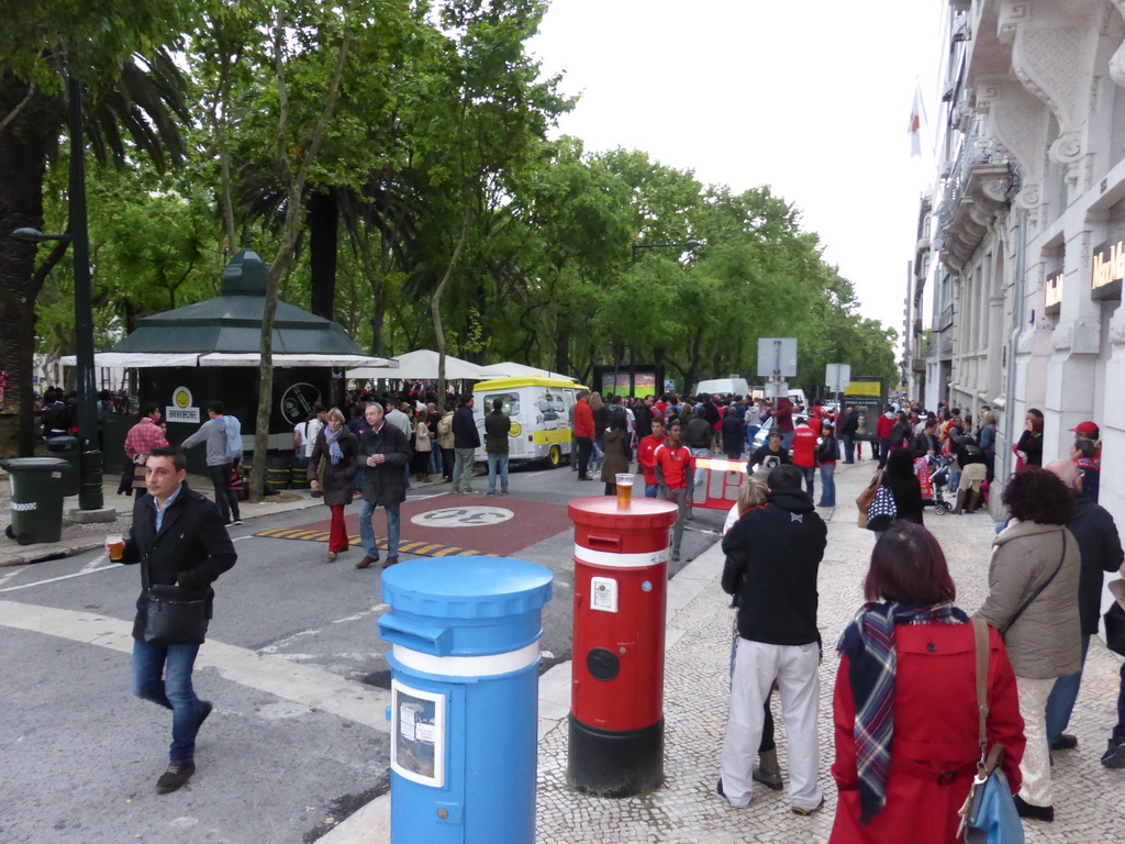 Fans of the S.L. Benfica soccer team watching the championship game on a screen at the Avenida da Liberdade avenue