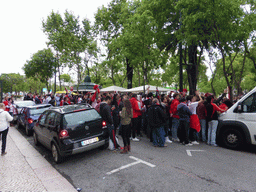 Fans of the S.L. Benfica soccer team watching the championship game on a screen at the Avenida da Liberdade avenue