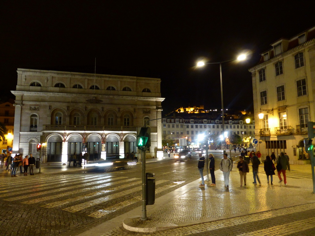 The Praça Dom João da Câmara square with the west side of the National Theatre D. Maria II, with a view on the Rossio Square and the São Jorge Castle, by night