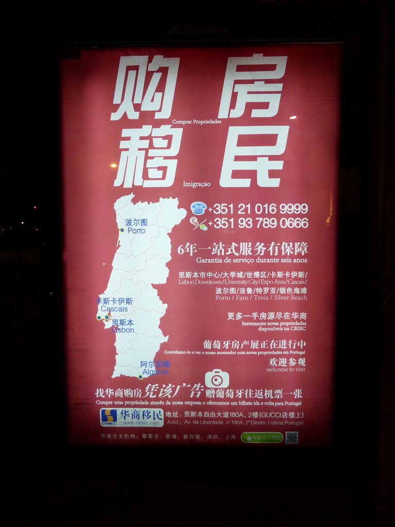 Commercial for Chinese house buyers at the Praça dos Restauradores square, by night