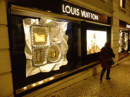 Miaomiao in front of the Louis Vuitton store at the Tivoli Forum shopping mall at the Avenida da Liberdade avenue, by night