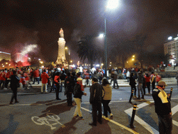 Fans of the S.L. Benfica soccer team celebrating the championship and the statue of the Marquess of Pombal at the Praça do Marquês de Pombal square, by night