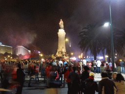 Fans of the S.L. Benfica soccer team celebrating the championship and the statue of the Marquess of Pombal at the Praça do Marquês de Pombal square, by night