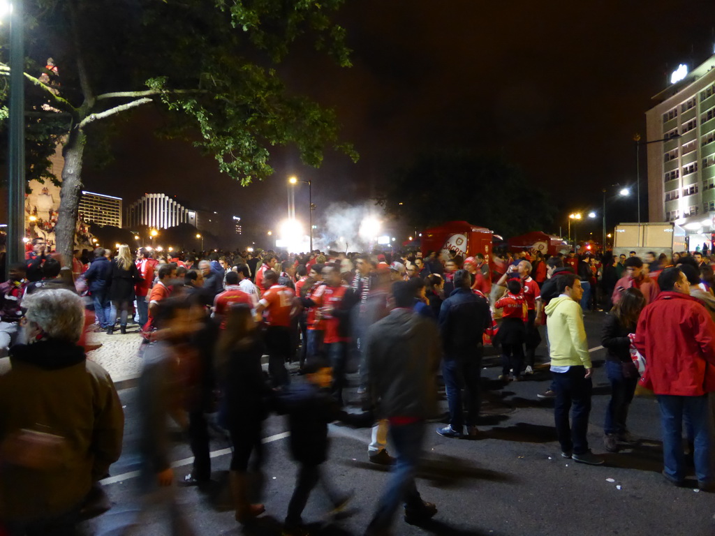 Fans of the S.L. Benfica soccer team celebrating the championship and the statue of the Marquess of Pombal at the Praça do Marquês de Pombal square, by night