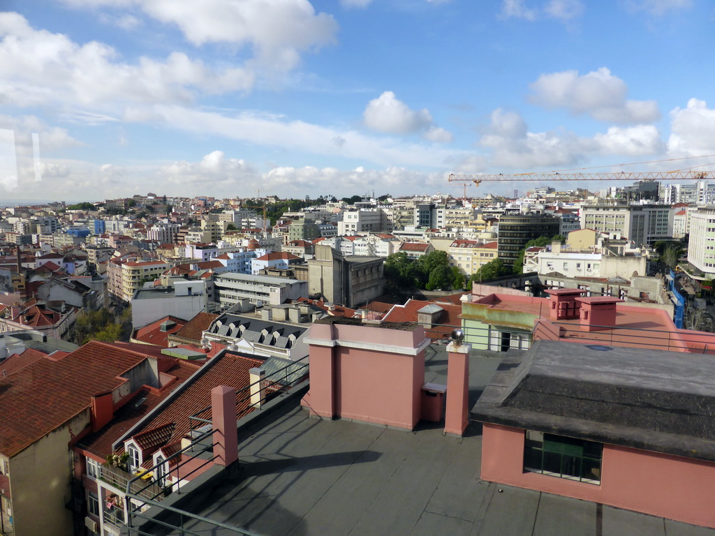 The west side of the city with the Ponte 25 de Abril bridge and the Cristo Rei (Christ the King) statue, viewed from the restaurant at the top floor of the Embaixador Hotel