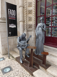 Statues of fado artists in front of the souvenir shop at the Rossio Railway Station at the Praça Dom João da Câmara square